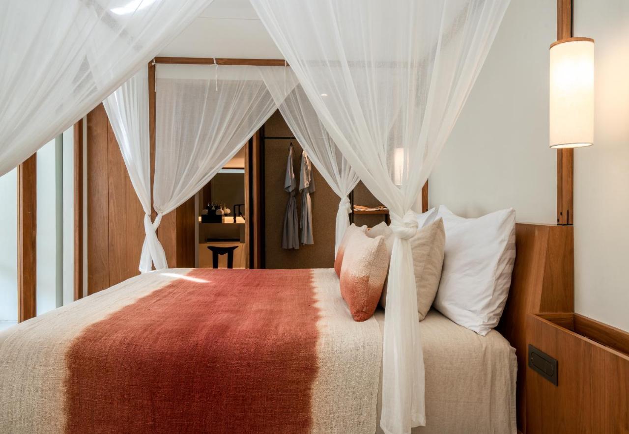 Hotel Bisma Eight - Chse Certified Ubud Exterior foto A bed with mosquito netting